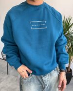 دورس یقه گرد رگلان مردانه رنگ کلهغازی با چاپ DO IT BETTER و پارچه داخل کرک